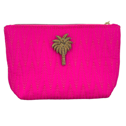 Turquoise Tribeca make up bag with a palm tree pin.
